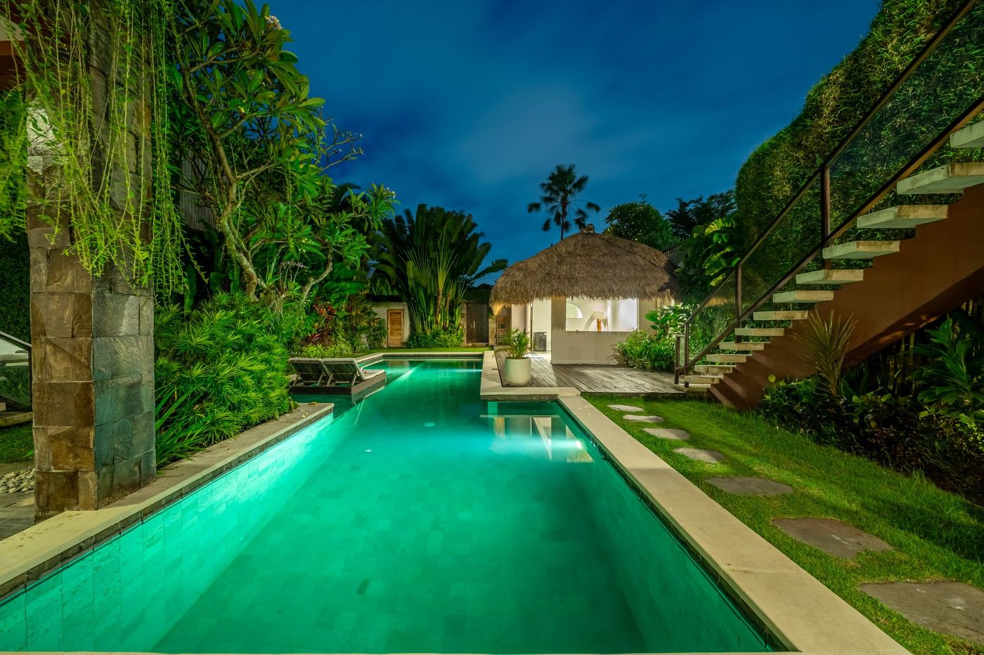 Villa Amerta A pool and garden at dusk