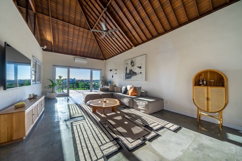Living area with garden outlook and full-height sliding doors