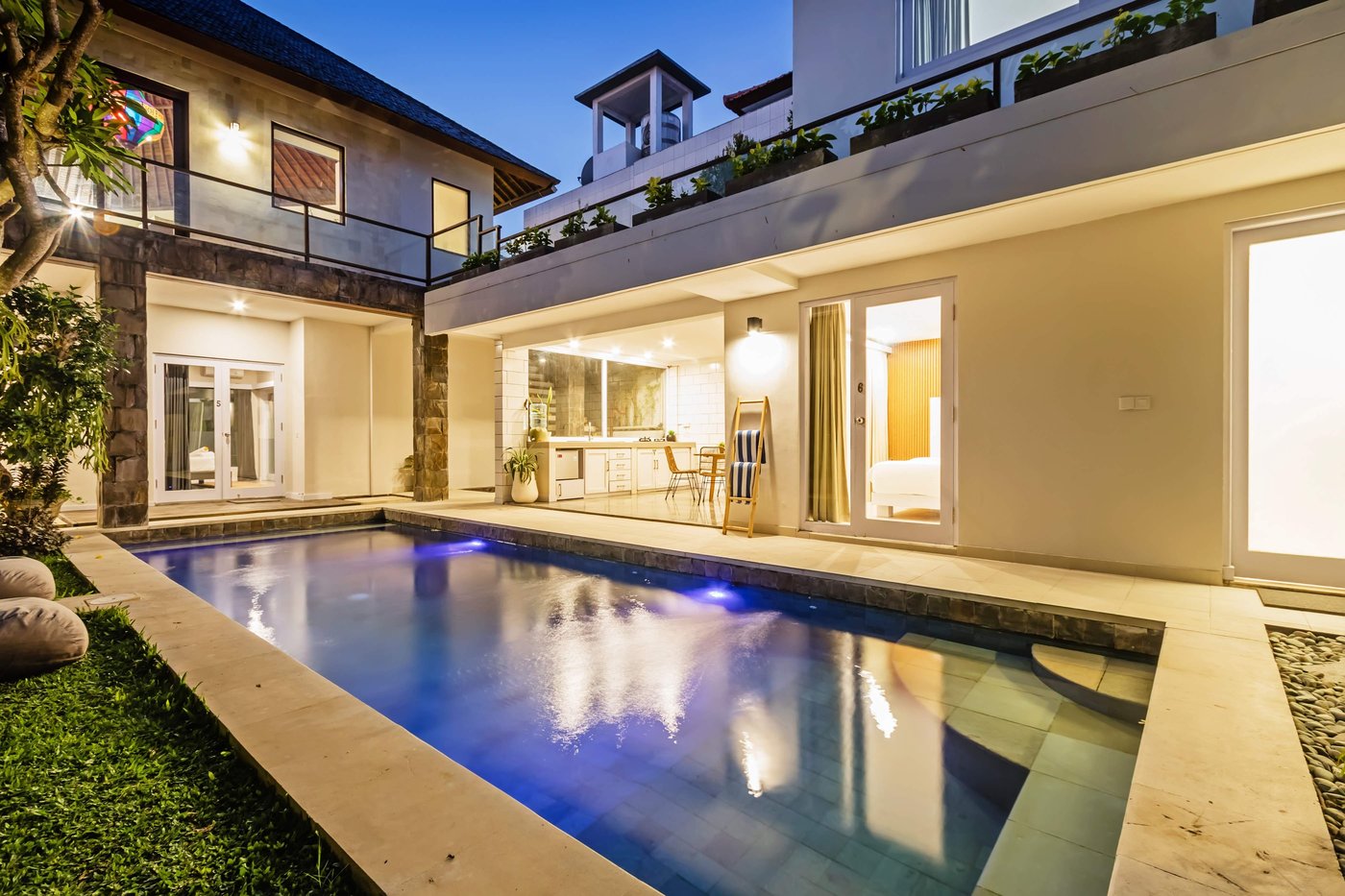 Villa Amerta B and pool lit at dusk