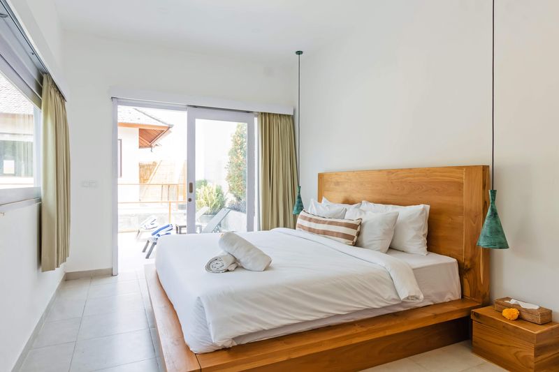 Bedroom with timber panelled headboard